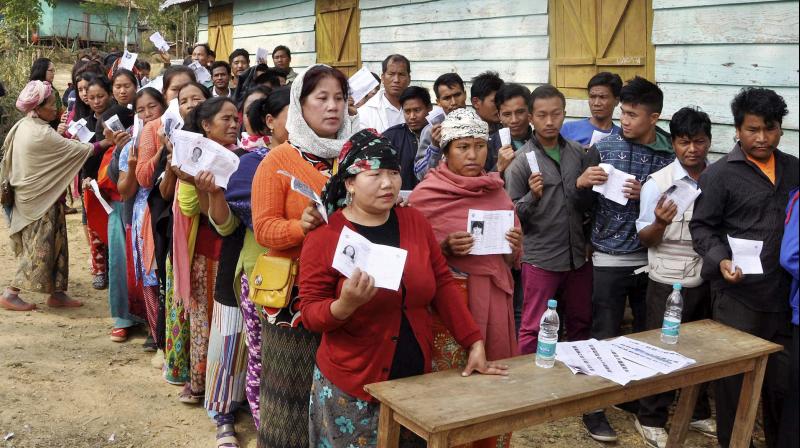 Manipuri people stand in queues to cast their votes. (Photo: PTI)