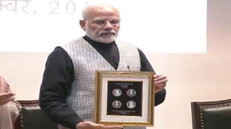 On the eve of Atal Bihari Vajpayees 94th birth anniversary, Prime Minister Narendra Modi on Monday released a Rs 100 commemorative coin in the memory of the former premier. (Photo: Twitter | @BJP4India)