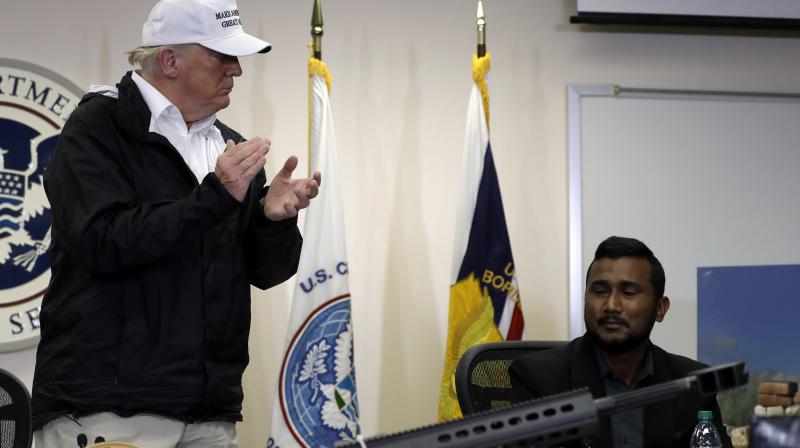 President Donald Trump recognizes Reggie Singh, brother of slain California police officer Ronil Singh at roundtable on immigration and border security at US Border Patrol McAllen Station, during a visit to southern border on Thursday. (Photo: AP)