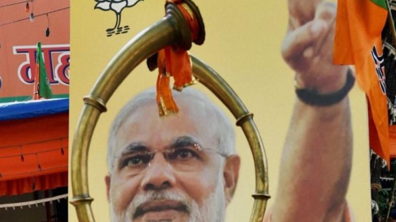 A poster showing photograph of Prime Minister Narendra Modi. (Photo: PTI)