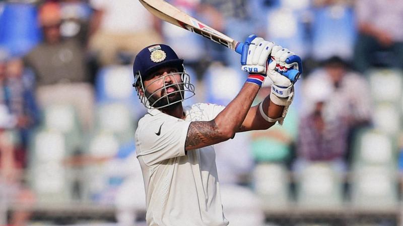 India batsman Murali Vijay plays a shot on the second day of the fourth Test match against England in Mumbai on Friday. (Photo: AP)