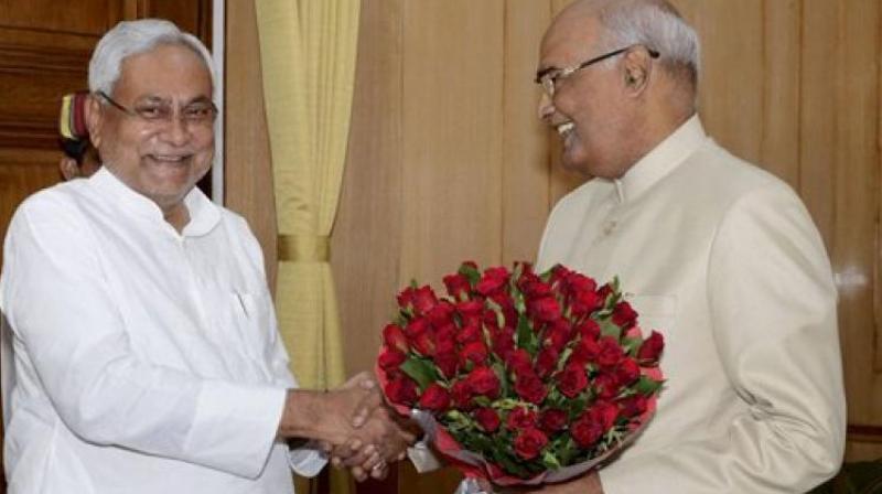 Bihar Chief Minister Nitish Kumar greets Governor Ram Nath Kovind on being announced as NDAs presidential candidate, in Patna on Monday. (Photo: PTI)