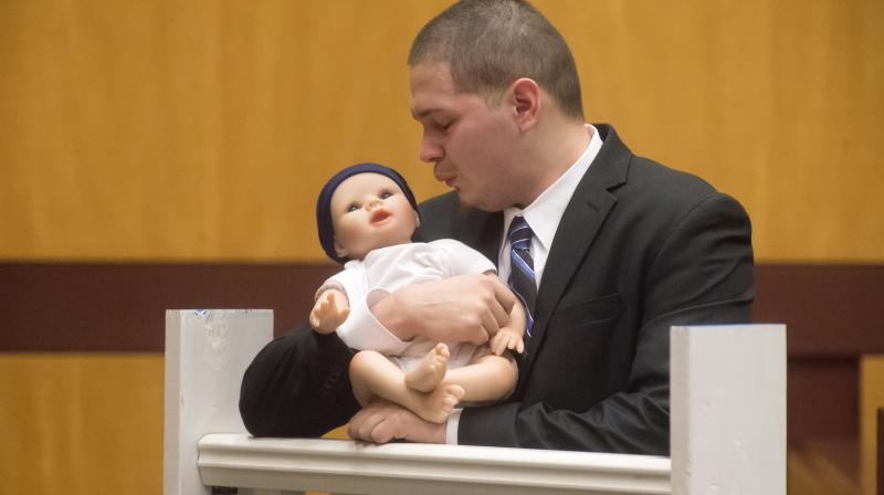 Tony Moreno demonstrates to the jury how he held his son Aaden on the railing of the Arrigoni Bridge in the final moments of Aadens life, during Morenos trial Thursday. (Photo: AP)