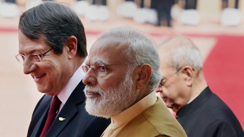 President Pranab Mukherjee and Prime Minister Narendra Modi with Cyprus President Nicos Anastasiades during his ceremonial welcome at the Rashtrapati Bhavan in New Delhi on Friday. (Photo: PTI)