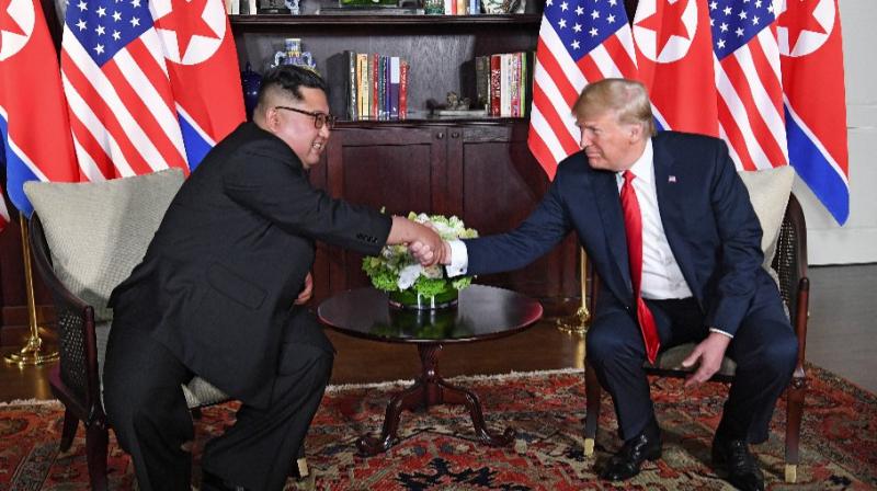 Donald Trump and Kim Jong Un make history by becoming the first sitting US and North Korean leaders to meet and shake hands. (Photo: AFP)