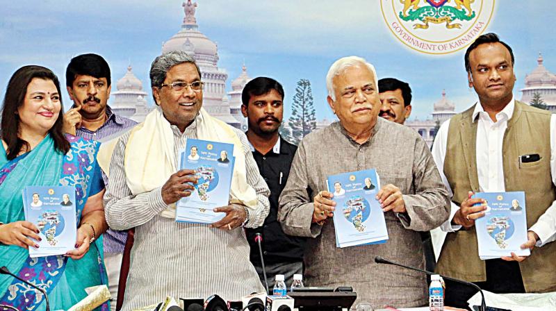 CM Siddaramaiah releases New NRI Policy of Karnataka in Bengaluru on Friday.