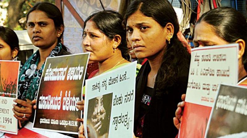 Members of NFIW protest against molestation of girls on the New Year Eve, in Bengaluru on Friday. (Photo: DC)