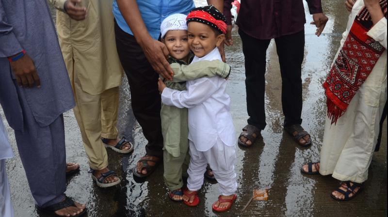 Young kids greet each other after offering Namaaz on the occasion of Eid-ul-Fitr in Mumbai. (Photo: Shripad Naik)