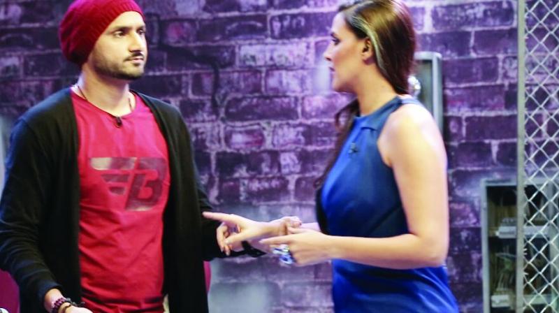 Actress Neha Dhupia and cricketer Harbhajan Singh argue on the show Roadies Rising.