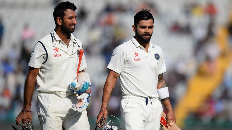 Virat Kohli had a lot of praise in store for Cheteshwar Pujara, who was instrumental for India in the four-match Test seires against Australia. (Photo: AFP)