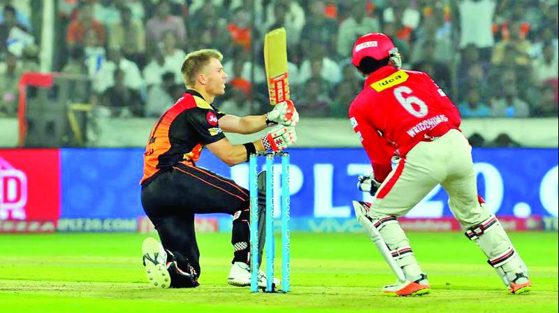 Sunrisers Hyderabad captain David Warner plays a shot en route to his unbeaten 70 against Kings XI Punjab on Monday. It was Warners record fifty in the IPL. (Photo: P. SURENDRA)