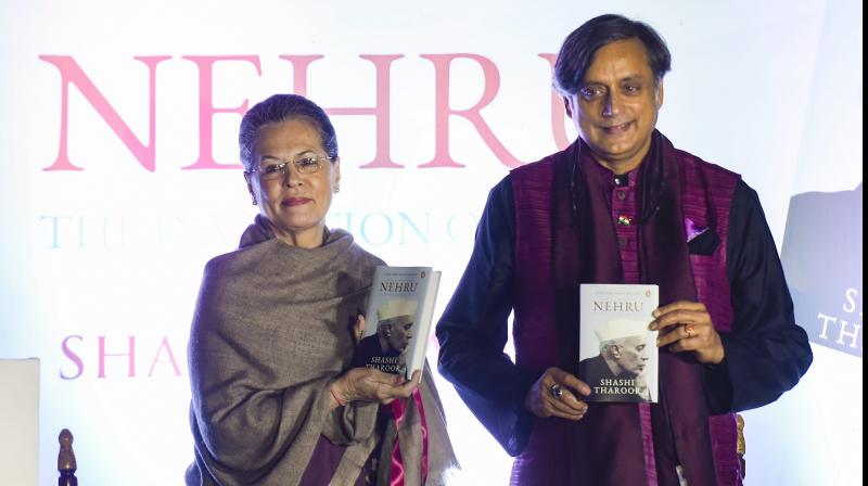 Former Congress president Sonia Gandhi with Congress MP Shashi Tharoor during latters book Nehru: The Invention of India launch event in New Delhi on Tuesday. (Photo: PTI)