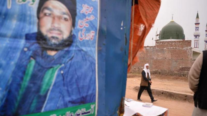 Malik Bashir Awan, father of Mumtaz Qadri, who was hanged last year for murder of a governor who criticized Pakistans blasphemy law and defended a Christian woman, arriving at his sons shrine on the outskirts of Islamabad. (Photo: AFP)