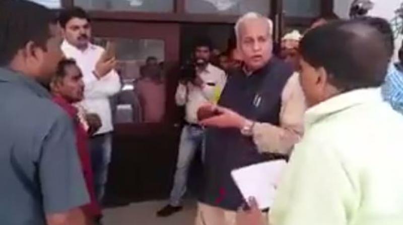 Senior Uttar Pradesh Minister Satyadev Pachauri purportedly insults a physically disabled employee during a surprise inspection. (Photo: videograb)