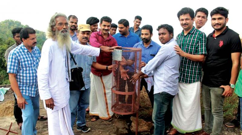 Members of Ekos set up waste bin at the hilltop of Vayalada near Balusserry. (Photo: DC)