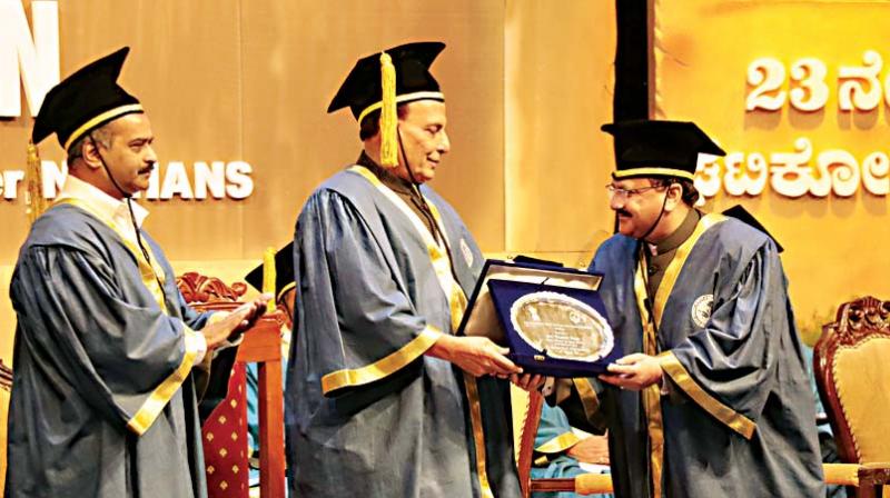 Union Home Minister Rajnath Singh handing out degrees at the 23rd convocation ceremony at NIMHANS in Bengaluru on Saturday (Photo: DC)