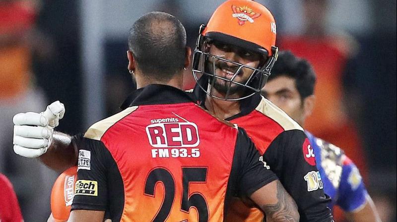 Shikhar Dhawan of the Sunrisers Hyderabad with teanmmate Vijay Shankar celebrates the win during an IPL match against Mumbai Indians in Hyderabad on Monday. (Photo: AP)