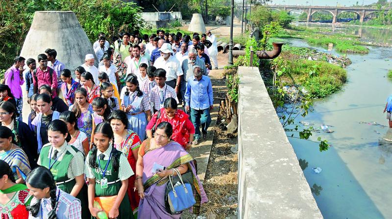 Students, activists, professors and others participated in the Musi River walk meant to highlight problems facing the river, in Hyderabad on Friday. 	(Photo: Deccan Chronicle)