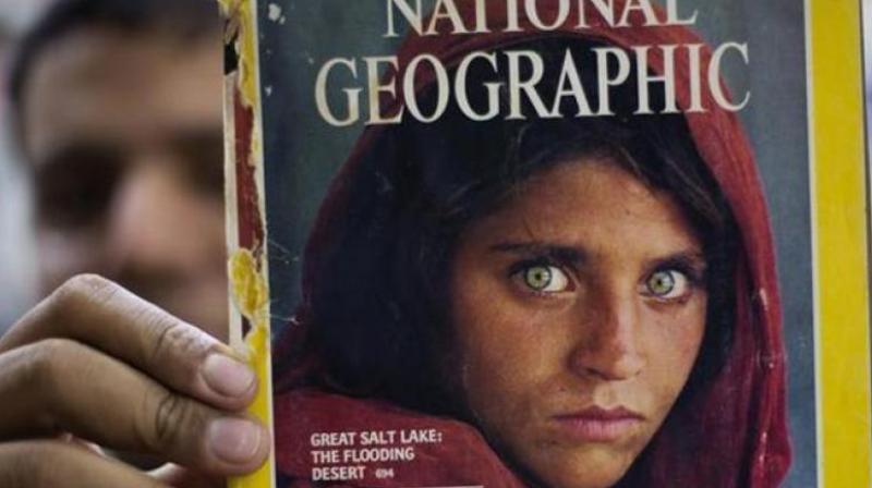 Sharbat Gulas blazing grÂ­een eyes were captured in an image taken in a Pakistan refugee camp in the 1980s that became the magazines most famous cover. (Photo: AP)