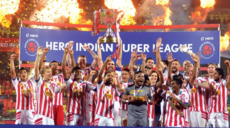 Atletico De Kolkata team on the victory stand after winning the title against Kerala Blasters FC during the ISL final match at Jawaharlal Nehru International Stadium in Kochi on Sunday. 	(Photo: SUNOJ NINAN MATHEW)