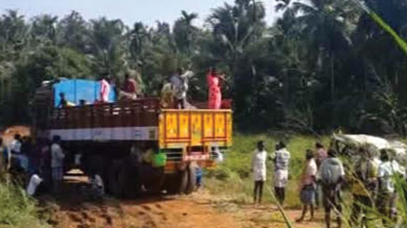 Truck carrying labourers from Salem which was taken into custody by Puthukkad police on Sunday. 	BY ARRANGEMENT