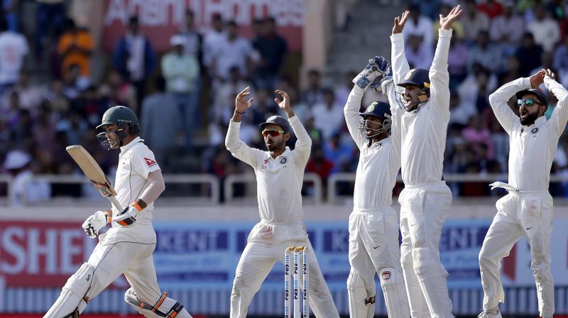 Virat Kohli, right, and teammates appeal unsuccessfully for the dismissal of Australias Glenn Maxwell, left, during the fifth day of their third test cricket match in Ranchi, India. (Photo: PTI)