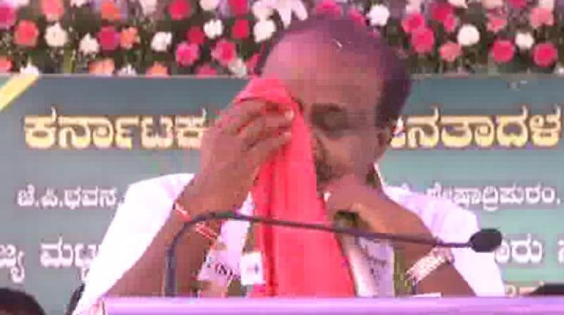Throughout his address, HD Kumaraswamy was teary-eyed and repeatedly kept wiping his tears away with a handkerchief. (Photo: ANI)
