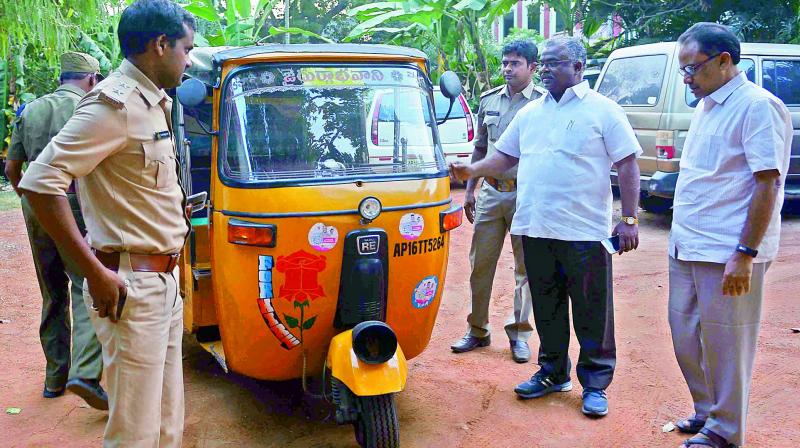 DTC E. Meera Prasad (second from right) seizes the vehicle in Vijayawada on Wednesday. (Photo: DC)