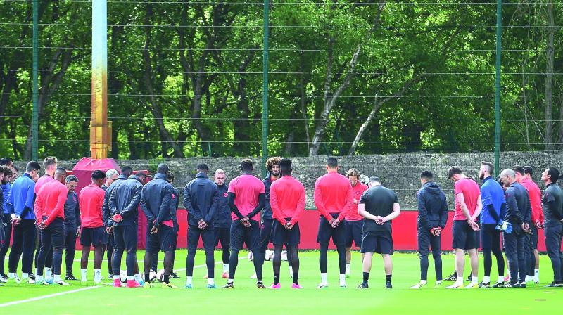 Manchester United players observe a minutes silence for the victims of Mondays terror attack in Manchester, at a training session on Tuesday. (Photo: AFP)