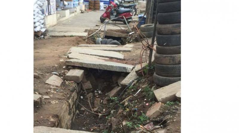 The poor condition of footpath on Doddabommasandra main road.