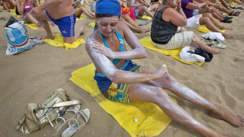 Sunscreen users receive less than half the sun protection they think. (Photo: AFP)
