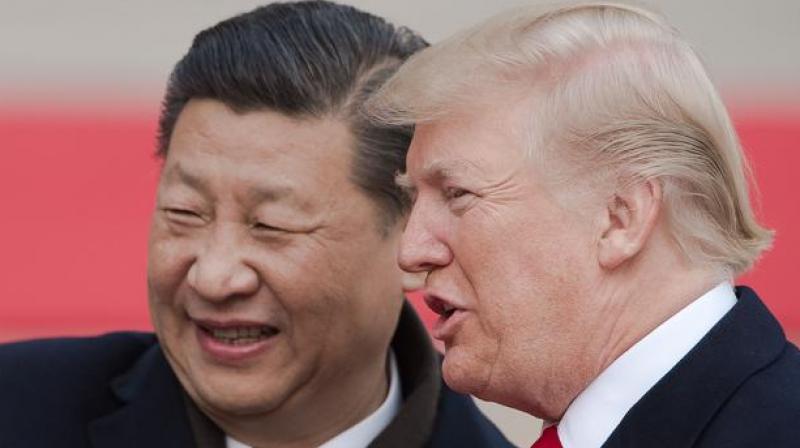 Chinas President Xi Jinping and his US counterpart Donald Trump attend a welcome ceremony in Beijing on 9 November. (Photo: AFP)