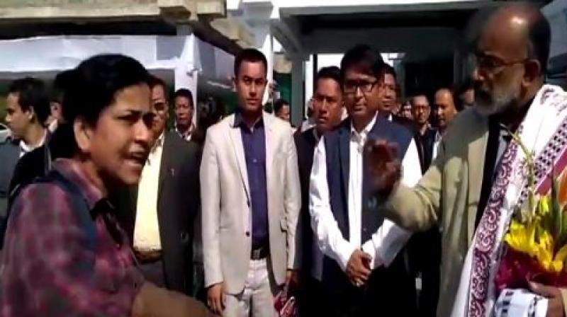 A woman is seen, in a video, blasting Union Minister of State for Tourism KJ Alphons for her flight getting delayed because of his arrival at Imphal airport. (Photo: ANI videograb)