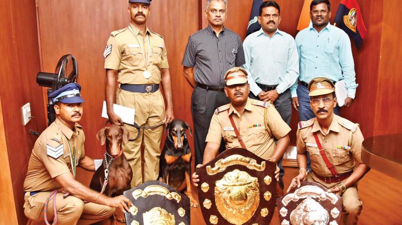 City police commissioner A. K. Viswanathan along with the dogs from the dog squad and their trainers at his office in Vepery. (Photo:DC)