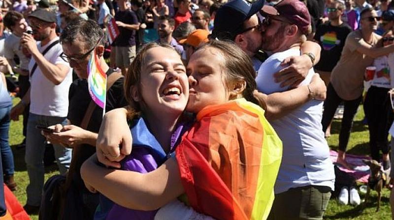 Supporters of the same-sex marriage \Yes\ vote gather to celebrate the announcement in a Sydney park on November 15, 2017. (Photo: AFP)