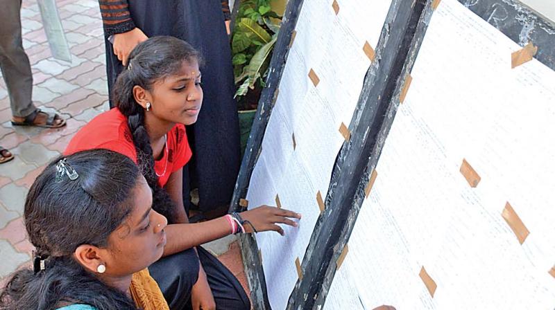 Students form Lady Sivaswami Higher Secondary School checks out the results. (Photo:DC)