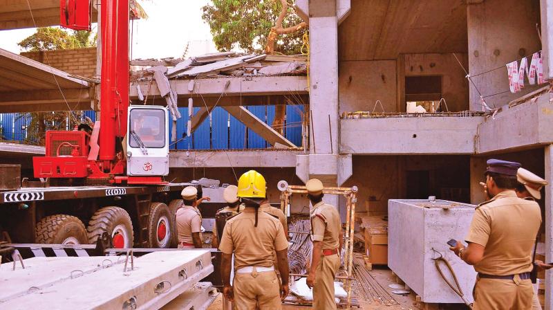 Fire and rescue personnel start operations to rescue the people trapped inside the collapsed building in Chetpet, on Wednesday. (Photo:DC)