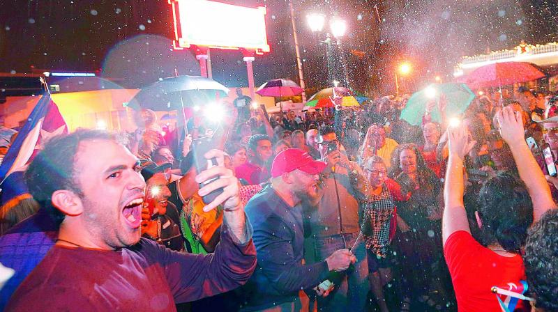 Cuban Americans celebrate upon hearing about the death of Cuban leader Fidel Castro in the Little Havana neighborhood of Miami, Florida on Saturday. (Photo: AFP)