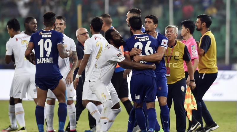 Players of Chennaiyin FC (Blue Jersy) and North East United clash during their Indian Super League (ISL) match at Jawaharlal Nehru Stadium in Chennai on Saturday. (Photo: AP)