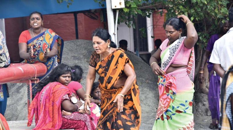 Grieving relatives near the government hospital.