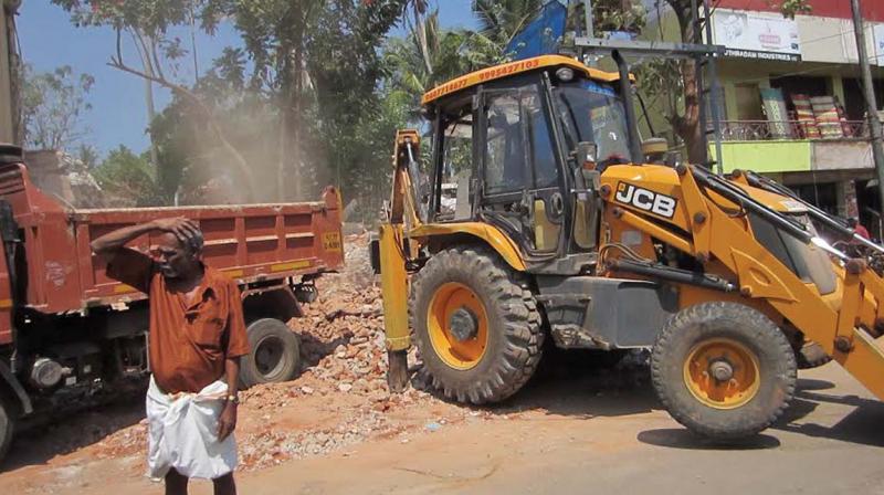 Demolition in progress at Peyad junction on Saturday. (Photo: DC)