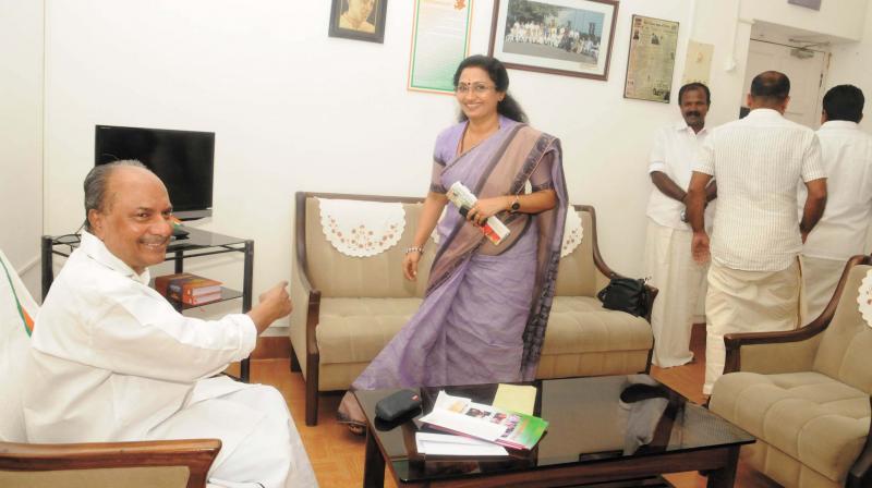 Congress leader A. K. Antony who visited the KPCC office in Thiruvananthapuram on Tuesday after a brief break was besieged by hordes of party leaders. Here, it is the turn of former All-India Youth Congress secretary Deepthi Mary Varghese.	 (Photo: A.V. MUZAFAR)