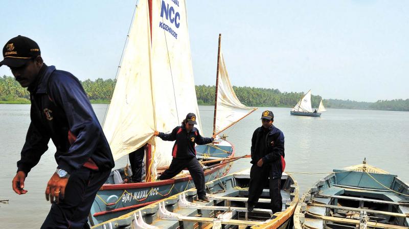 NCC cadets get ready for their six-day sailing expedition from Vengali boat house near Kozhikode on Tuesday. 	 (Photo: Venugopal)