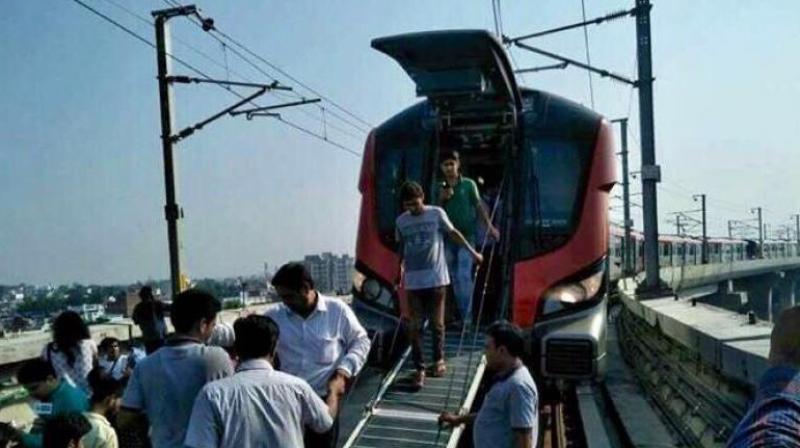 Stuck passengers, commuting in Lucknow Metro on its maiden commercial run, were taken out from the back through the emergency exit(Photo: Twitter | @yadavakhilesh)