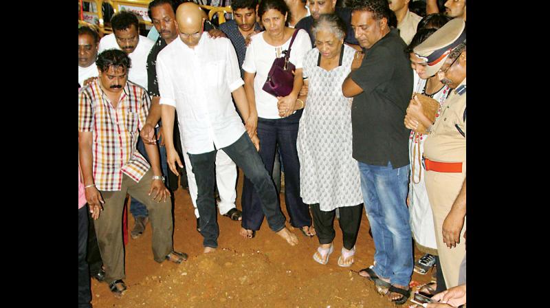 Gauri Lankeshs family at the site of her grave at the Chamarajpet burial ground in Bengaluru on Wednesday. (Photo: KPN)