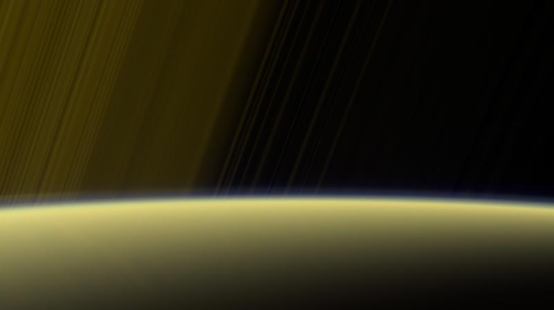This false-color view from NASAs Cassini spacecraft gazes toward the rings beyond Saturns sunlit horizon, where a thin haze can be seen along the limb. (Image credit: NASA/JPL-Caltech/Space Science Institute)