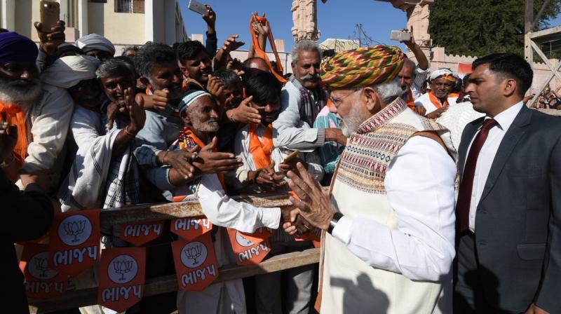 Modi concluded the Bharatiya Janata Partys (BJP) election campaign with prayers at Ambaji temple in Banaskantha and then took a flight in sea-plane to Dharoi Dam in Mehsana district from Sabarmati River in Ahmedabad. (Photo: Twitter)