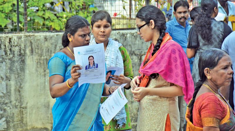 An invigilator checks certificates of a candidate before Neet 2017, held on May 7.	(Photo: DC)