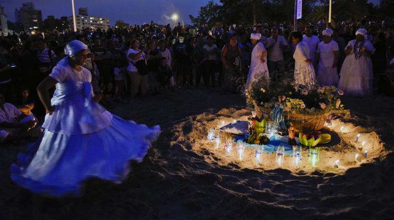 Candles, songs and faith: Uruguayans celebrate the Goddess of the Sea