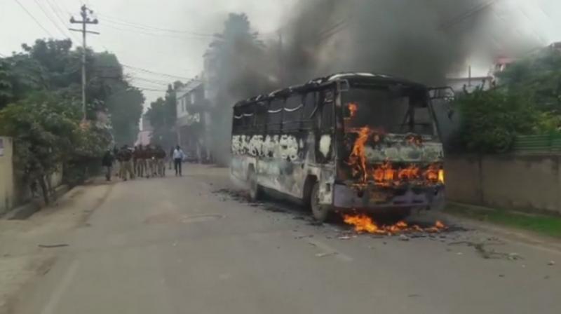 Students at Allahabad in Uttar Pradesh shouted slogans on the streets, hurled stones and set fire to a bus on Monday over the killing of 26-year-old law student at a restaurant by a group of men on Friday. (Photo: ANI | Twitter)